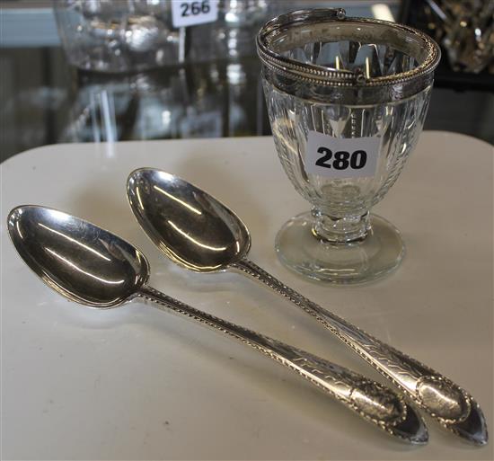Pr Georgian provincial silver celtic tip table spoons (a.f) and an antique silver mounted glass sugar basket
